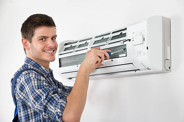 istock Technician Repairing Air Conditioner 591428394