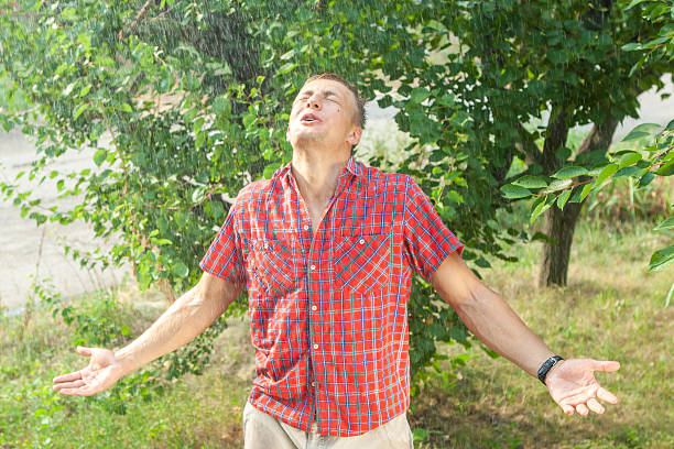 istock Sexy young man wet in rain 591429060