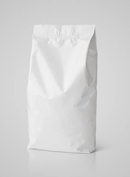istock Snack blank white paper bag package on gray 591429462