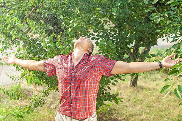 istock Sexy young man wet in rain 591429494