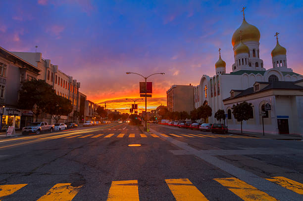 Geary Street of San Francisco at Sunset Geary Street, Store, church, sunset, vanishing point, cars. contra costa county stock pictures, royalty-free photos & images