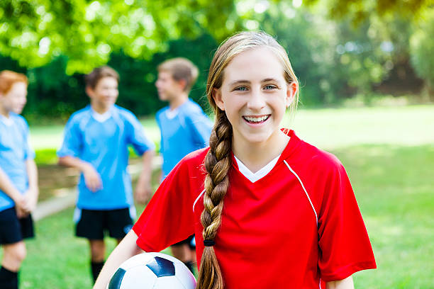 istock Confident female athlete on soccer field 591430598
