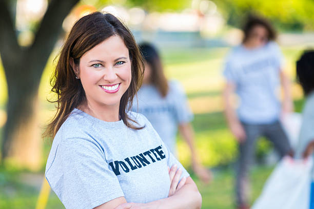 istock Confident volunteer helps with community clean-up 591430744