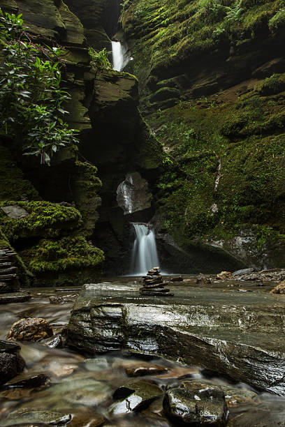 istock Stacked Rocks and waterfall at St. Nectan's Glen 591431290