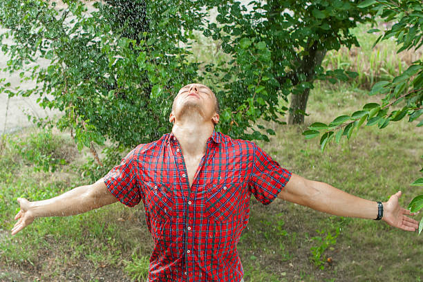 istock Sexy young man wet in rain 591431320