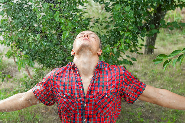 istock Sexy young man wet in rain 591431402