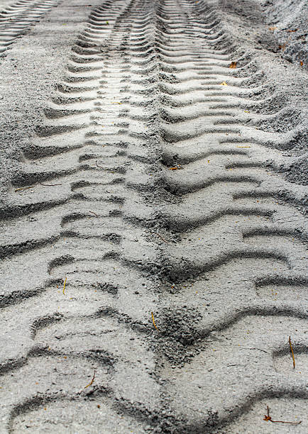 istock Tire track on muddy road 591432310