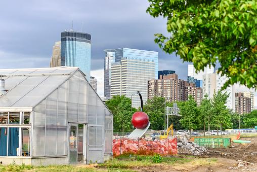 Minneapolis, Minnesota, USA. - July 8, 2016: Iconic Spoon and Cherry shown during Reconstruction of the Sculpture Garden  at The Walker Art Center, a modern art museum near downtown Minneapolis, Minnesota. A major reconstruction is underway here while construction on the busy Hennepin and Lyndale Avenues is also happening.