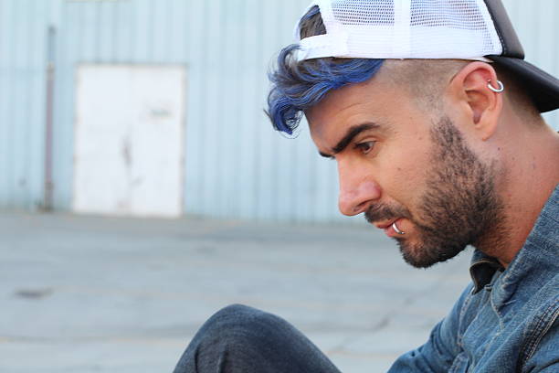 istock Sad and depressed rebel looking man 591433752