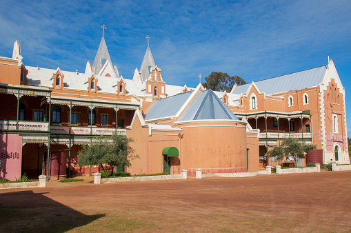 New Norcia,WA,Australia-July 15,2016: Historic St. Gertrude's Ladies College with brick Spanish Gothic architecture and balcony in the historic tourist monastic town of New Norcia, Western Australia.