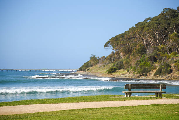 istock Wood bench near beach and sea 591436558