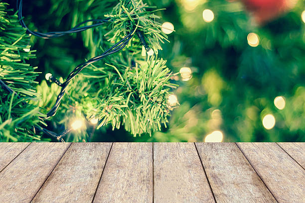 istock christmas lights hanging in christmas tree 591437752
