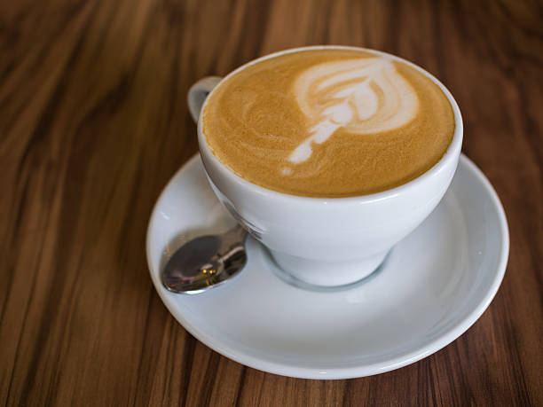 istock Coffee cup on a wooden table 591438624