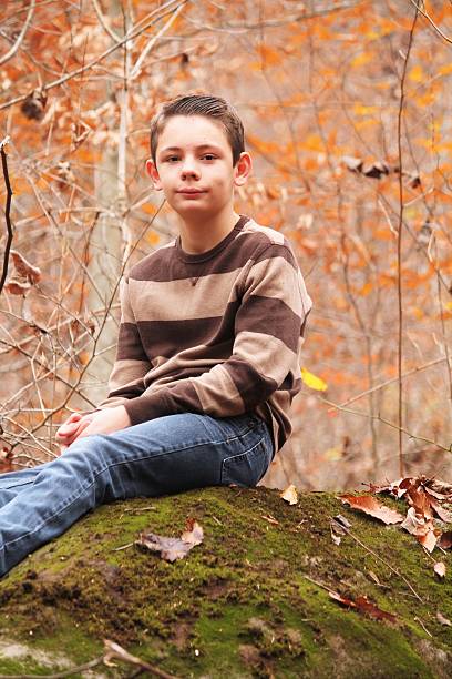istock Teenage Boy on Rock 591438648