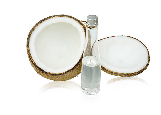 Coconut with coconut oil isolated on white background. This has clipping path.