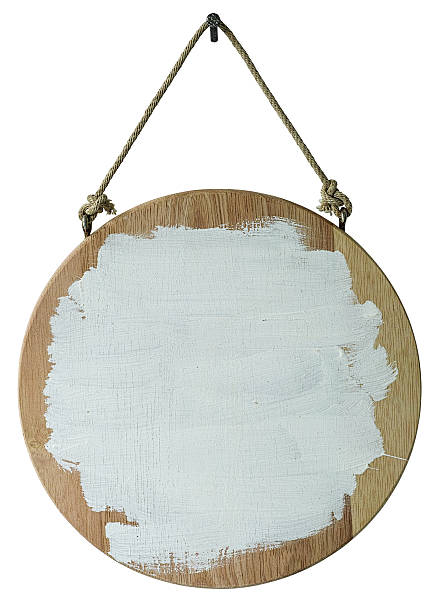 istock Round wood sign board hanging by rope from a nail. 591442856