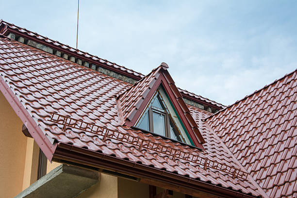 istock Red metallic roof with attic and snow guards 591443082