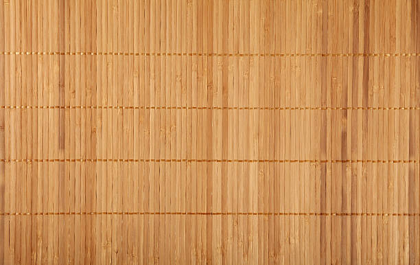 istock Brown beige bamboo wood mat background texture 591444530