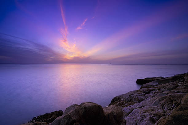 Sunrise and Coast Rock stock photo