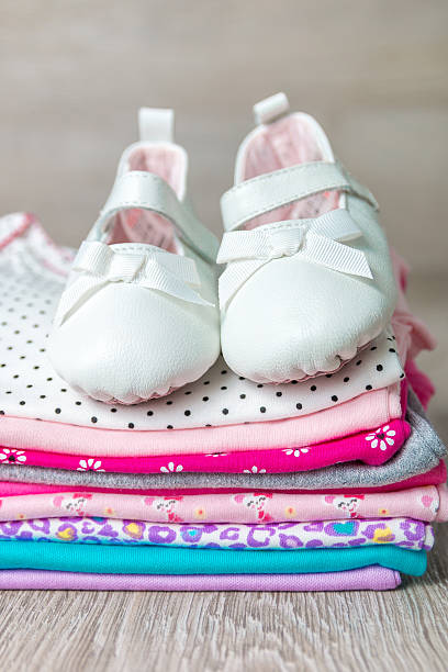 istock Folded pink and white bodysuit with shoes 591781768
