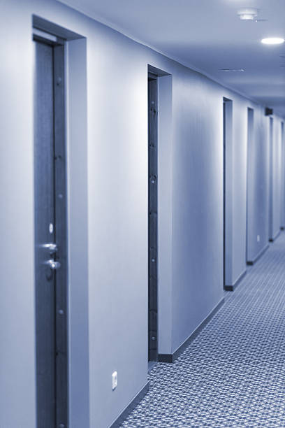 istock Interior of hotel. Empty corridor with rooms. 591782394