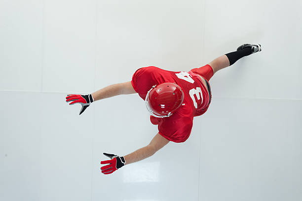 istock American football player blocking 591792260