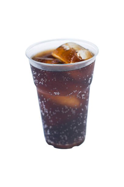 istock cola drink in plastic glass with ice isolated on white 591796256