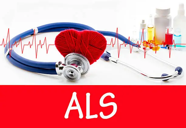 The diagnosis of als. Phonendoscope and vaccine with drugs. Medical concept.