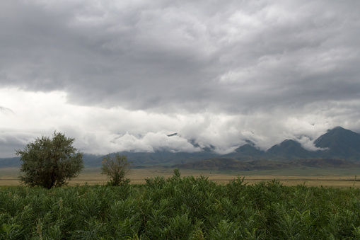 low storm clouds in the mountains of Kazakhstan near the lake Alakol