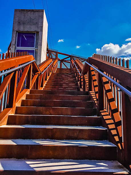 rusty stairs and blue sky stock photo