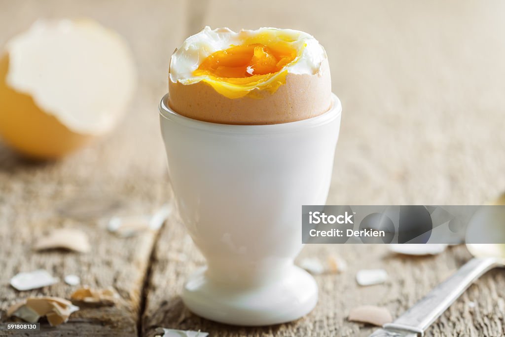 Perfect soft boiled egg for breakfast Perfect soft boiled egg on a table. Traditional food for healthy breakfast. Close-up shot. Animal Egg Stock Photo