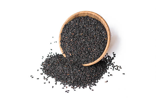 istock black sesame in wooden bowl on white background 591809196