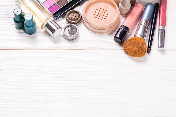 istock Various makeup products on wooden background with copyspace 591811316