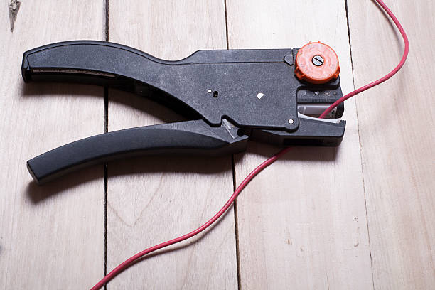 istock Set of electrical tool on wooden background. Accessories for engineering 591812112