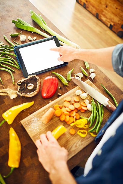 istock Cropped image of man touching blank screen of digital tablet 591812208