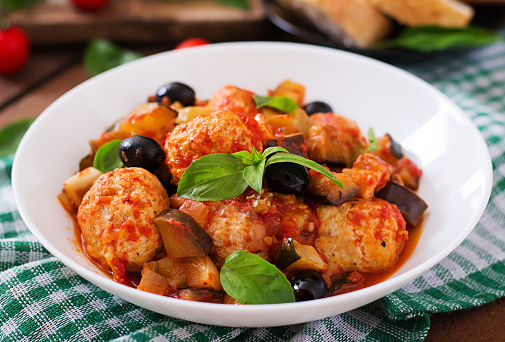 Juicy meatballs of turkey meat with vegetables (zucchini, eggplant, olive, tomato)
