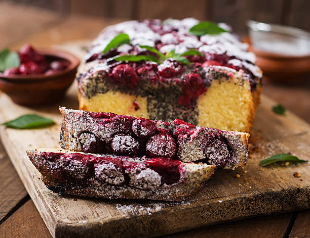 istock Cherry poppy seed cake dusted with powdered sugar 591813452