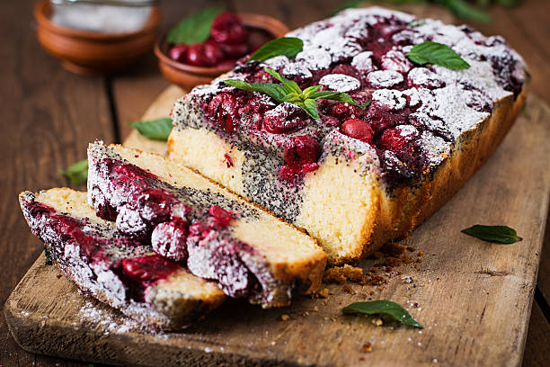 istock Cherry poppy seed cake dusted with powdered sugar 591813538
