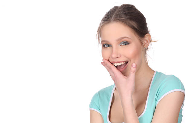 istock Smiling girl touching her face. Close up. White background 591814944