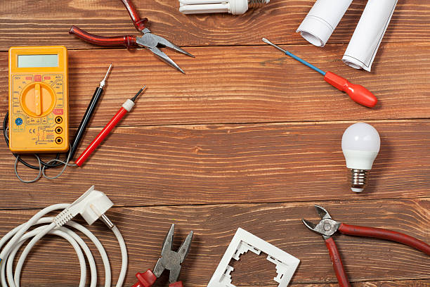 istock Set of electrical tool on wooden background. Accessories for engineering 591815002