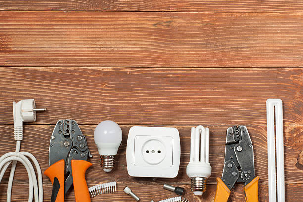 istock Set of electrical tool on wooden background. Accessories for engineering 591815060