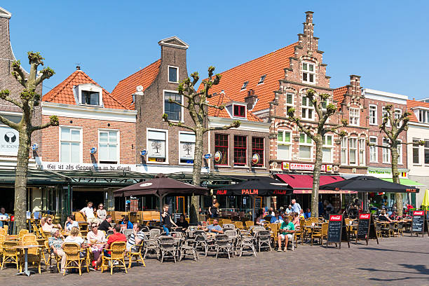 outdoor cafes on botermarkt, haarlem, netherlands - haarlem stockfoto's en -beelden