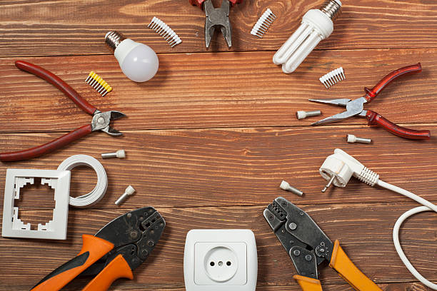 istock Set of electrical tool on wooden background. Accessories for engineering 591815808