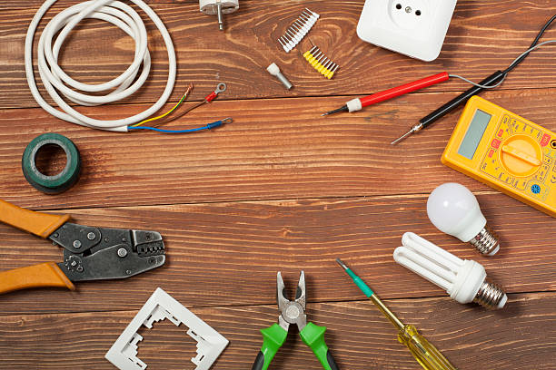 istock Set of electrical tool on wooden background. Accessories for engineering 591815884