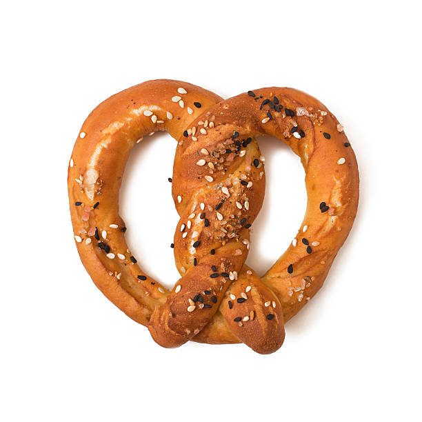 istock Pretzel with salt and sesame seeds isolated on white background 591815914