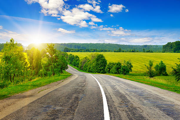 istock country road and beautiful sunset 591817624