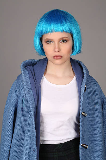 girl with blue hair and coat. close up. gray background - shirt fine art portrait vertical head and shoulders imagens e fotografias de stock