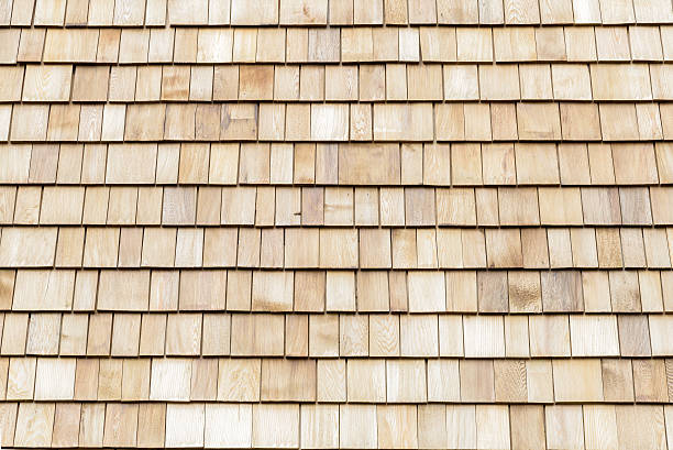 istock Several wood cedar shingles for siding or roofs. 591817874