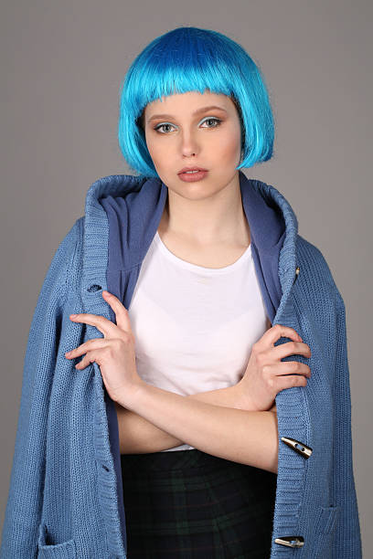 girl in blue wig and coat posing with crossed arms - shirt fine art portrait vertical head and shoulders imagens e fotografias de stock