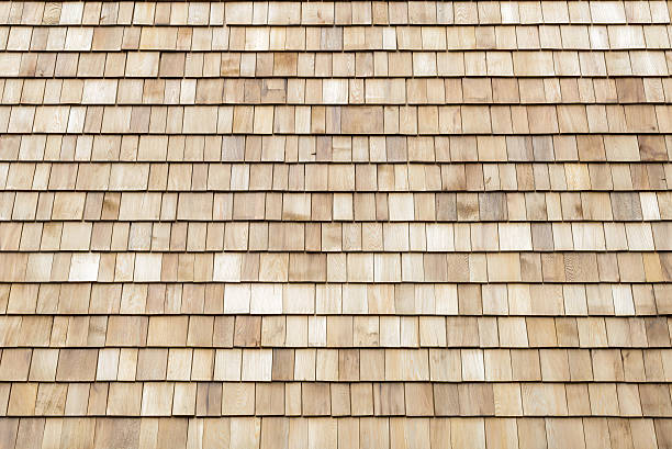 istock Several wood cedar shingles for siding or roofs. 591818104
